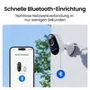 A security camera is shown mounted on a wall, with a smartphone displaying a connection interface next to it. A Bluetooth icon indicates wireless connectivity. Produktbild-Vorschau