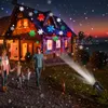 A family is walking towards a house decorated with snowflake lights projected from a spotlight. Produktbild-Vorschau