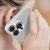 A close-up shot of a person holding a smartphone with a decorative camera lens protector. Anteprima dell’immagine prodotto