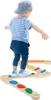 A child is playing on a wooden balance beam set. Produktbild-Vorschau