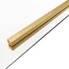 A close-up shot of a gold-colored metal bar on a clear surface, likely a shower enclosure. Produktbild-Vorschau