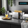 A modern kitchen counter with a toaster, bread, and orange juice. Anteprima dell’immagine prodotto