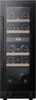 A wine cooler with bottles stored on shelves. Produktbild-Vorschau