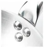A close-up view of the rivets on a stainless steel pan. Náhled obrázku produktu