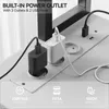 Close-up view of a built-in power outlet with multiple plugs and USB ports, showcasing its features. Náhľad obrázku produktu