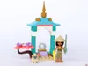 A LEGO set featuring a small temple-like structure, a minifigure, and a small creature. Produktbild-Vorschau