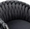 A close-up view of the back and armrest of a dark gray velvet chair with a braided design. Anteprima dell’immagine prodotto