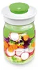 A glass jar filled with layered salad ingredients and a green lid. Náhled obrázku produktu