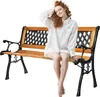 A woman is sitting on a wooden park bench with black metal legs. Podgląd zdjęcia produktu