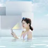 A woman in a pool using a waterproof phone case. Anteprima dell’immagine prodotto