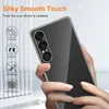 A hand holding a clear phone case over a phone. Produktbild-Vorschau