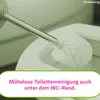 A toilet brush head is being used to clean inside a toilet bowl. Produktbild-Vorschau