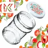 A glass jar and its lid are surrounded by various fresh vegetables and herbs. Produktbild-Vorschau