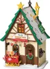 A festive, miniature Christmas house decorated with holiday elements. Produktbild-Vorschau