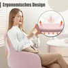 A woman is sitting in a pink ergonomic office chair, holding a tablet. An inset diagram shows the chair's lumbar support and how it supports the spine. Produktbild-Vorschau
