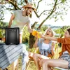 People enjoying drinks outdoors with a portable ice maker on a table. Podgląd zdjęcia produktu