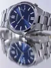 A close-up, angled shot of a Citizen watch with a blue dial, reflected on a mirrored surface. Podgląd zdjęcia produktu