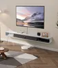 A modern living room with a wall-mounted TV cabinet and a TV. Anteprima dell’immagine prodotto