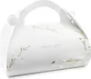 A white gift box with gold floral accents and the text "thank you". Náhled obrázku produktu