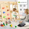 A mother and child playing on a wooden climbing frame with various toys scattered around. Podgląd zdjęcia produktu