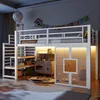 A children's loft bed with integrated play kitchen and storage, illuminated by LED lights. Produktbild-Vorschau