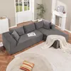 A sectional sofa in a living room setting, with a fireplace and windows in the background. Produktbild-Vorschau