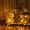 A string of LED lights draped over a cabinet with Christmas decorations. Voir les images du produit