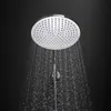 A showerhead with water spraying from it against a black background. Anteprima dell’immagine prodotto