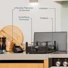 A Princess Raclette grill is shown on a kitchen counter with various accessories and labels pointing out its features. Produktbild-Vorschau