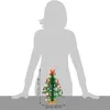 A silhouette of a person is shown behind a small, decorated Christmas tree. Dimensions are indicated with text and arrows. Anteprima dell’immagine prodotto