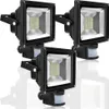Three black LED floodlights with motion sensors are arranged in a cluster on a white background. Produktbild-Vorschau
