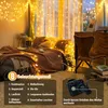 A bedroom scene with string lights draped over a bed and curtains, showcasing different lighting modes. Voir les images du produit