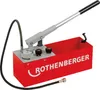 A red pressure testing pump with a handle, gauge, and hose. Podgląd zdjęcia produktu