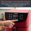 A hand is pressing a button on the control panel of a red air fryer. Produktbild-Vorschau