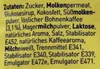 A close-up of text on a yellow background, likely ingredients or nutritional information from product packaging. Produktbild-Vorschau