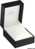 An open black watch box with a white cushion inside. Produktbild-Vorschau