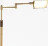 A close-up shot of a floor lamp with an adjustable arm. Produktbild-Vorschau