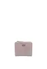 A small, light pink wallet with a zipper and a metallic logo on a white background.