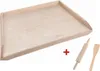 A wooden baking board with a rolling pin and spatula. Produktbild-Vorschau