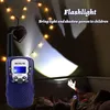A child is playing with a walkie-talkie in a dark room, creating shadow puppets on the wall with the flashlight. Náhled obrázku produktu