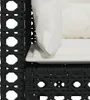 A close-up view of the corner of a black rattan sofa with white cushions. Produktbild-Vorschau