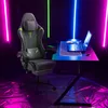 A gaming chair and desk setup with neon lighting. Produktbild-Vorschau