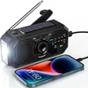 A black emergency radio with a solar panel and flashlight is shown charging a smartphone. Produktbild-Vorschau