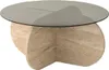 A round coffee table with a glass top and a travertine base. Produktbild-Vorschau