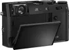 The back of a black Fujifilm X100VI compact camera with its screen flipped out. Anteprima dell’immagine prodotto