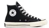 A black Converse Chuck 70 canvas high-top sneaker with white laces and a white sole, shown from the side against a white background. Voir les images du produit