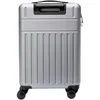 A silver suitcase is shown from the back. Voir les images du produit