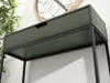 A close-up shot of a dark green console table with a black metal frame, showing the drawer. Produktbild-Vorschau