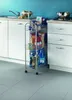 A kitchen scene with a rolling cart filled with groceries next to white cabinets and a sink. Produktbild-Vorschau