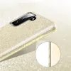 A close-up view of a gold glitter phone case with a camera module. Produktbild-Vorschau